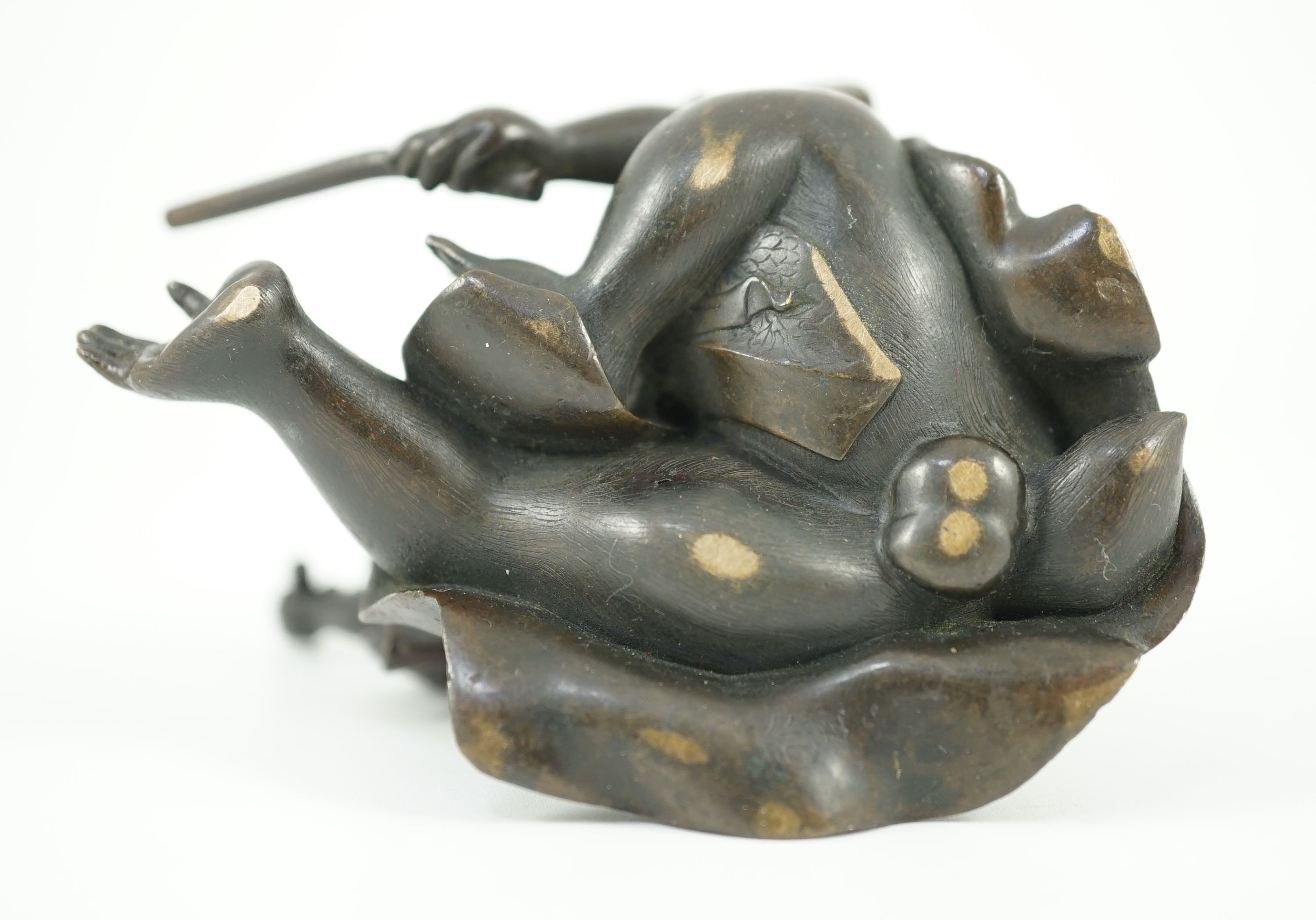 A Japanese bronze figure of a monkey, 19th century, 6cms high.